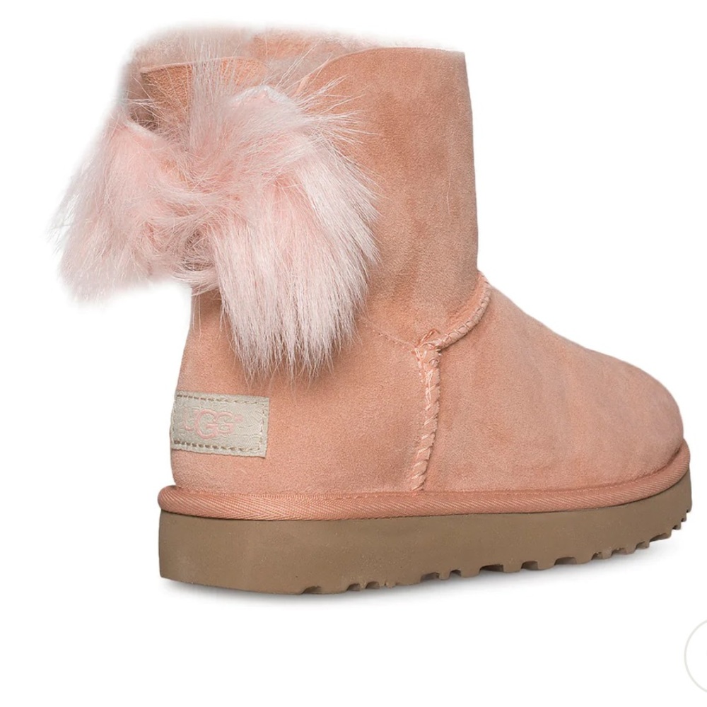 UGG SunTan Fluff Bow Mini Women’s boot size 9. NWT and box.